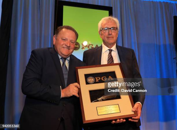 Of America president Paul Levy presents the Lifetime Achievement Award in Journalism to Lorne Rubenstein of Canada on stage at the 2018 Golf Writers...