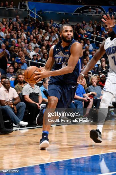 Aaron Harrison of the Dallas Mavericks handles the ball during the game against the Orlando Magic on April 4, 2018 at Amway Center in Orlando,...