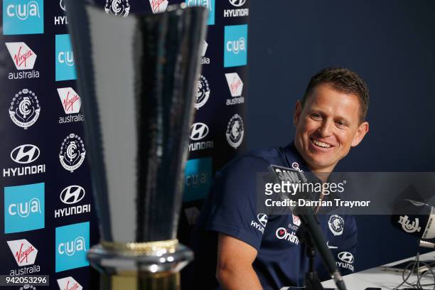 Brendan Bolton, senior coach of Carlton admires the size of the Richard Pratt Cup while he speaks to the media at Ikon Park on April 5, 2018 in...