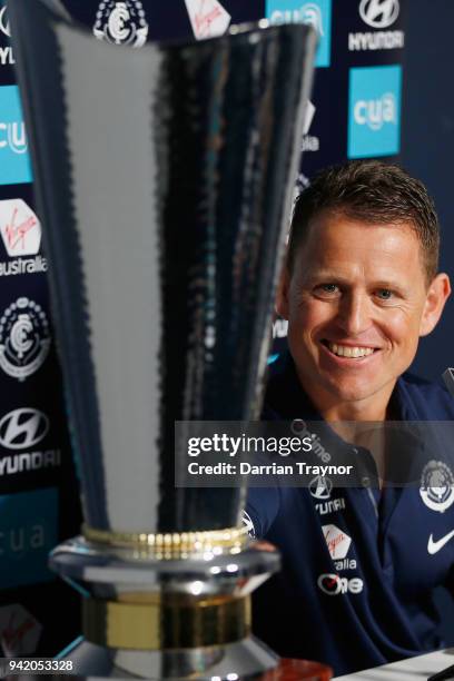 Brendan Bolton, senior coach of Carlton admires the size of the Richard Pratt Cup while he speaks to the media at Ikon Park on April 5, 2018 in...