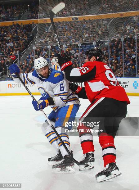 Marco Scandella of the Buffalo Sabres and Matt Duchene of the Ottawa Senators battle for position during an NHL game on April 4, 2018 at KeyBank...