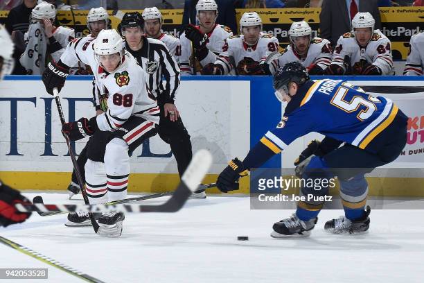 Colton Parayko of the St. Louis Blues defends against Patrick Kane of the Chicago Blackhawks at Scottrade Center on April 4, 2018 in St. Louis,...