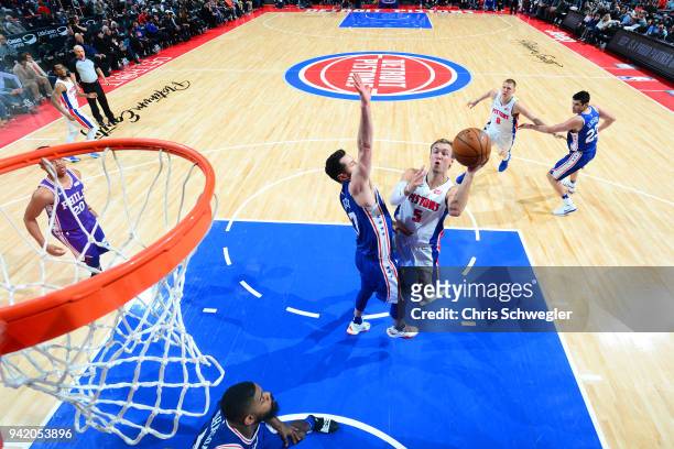 Luke Kennard of the Detroit Pistons goes to the basket against the Philadelphia 76ers on April 4, 2018 at Little Caesars Arena in Detroit, Michigan....