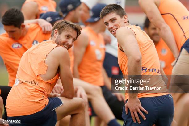 Dale Thomas and Matthew Kreuzer of the Blues stretch before a training session at Ikon Park on April 5, 2018 in Melbourne, Australia.