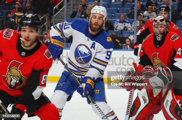 Christian Wolanin and Craig Anderson of the Ottawa Senators defend the net against Ryan O'Reilly of the Buffalo Sabres during an NHL game on April 4,...