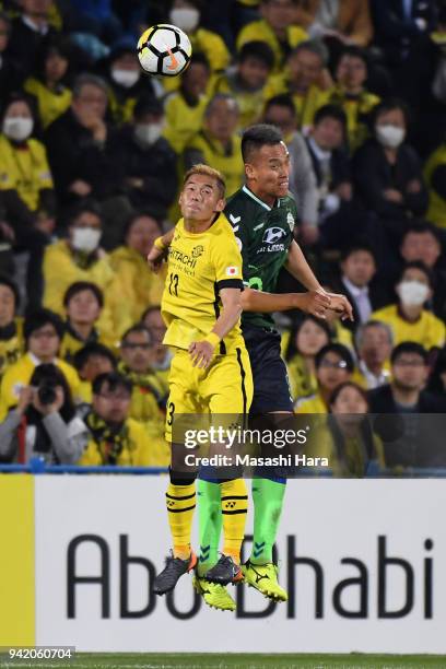 Kim Shin Wook of Jeonbuk Hyundai Motors and Ryuta Koike of Kashiwa Reysol compete for the ball during the AFC Champions League Group E match between...