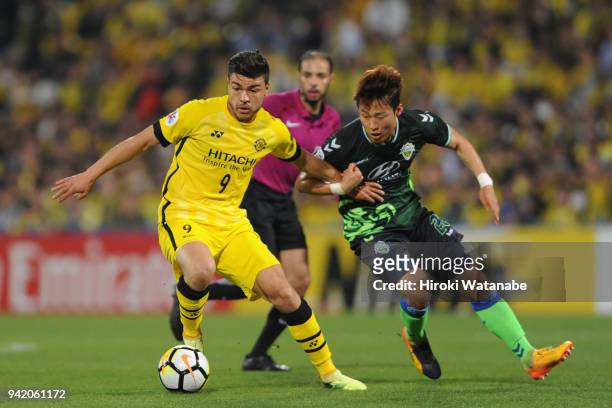 Cristiano of Kashiwa Reysol and Son Jun-ho of Jeonbuk Hyundai Motors compete for the ball during the AFC Champions League Group E match between...