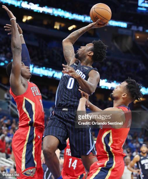 In a December 2017 file image, the Orlando Magic's Jamel Artis shoots against the New Orleans Pelicans at the Amway Center in Orlando, Fla. On...