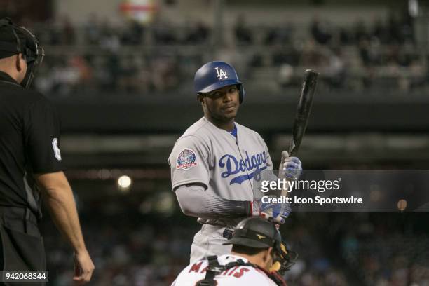 Los Angeles Dodgers right fielder Yasiel Puig looks back at home plate umpire Mark Carlson after a called strike during the Arizona Diamondbacks game...