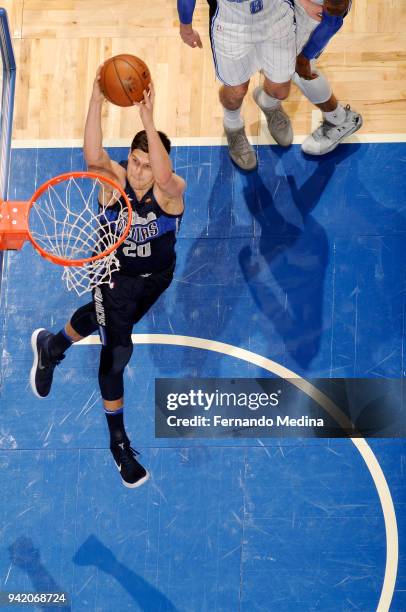 Doug McDermott of the Dallas Mavericks dunks the ball during the game against the Orlando Magic on April 4, 2018 at Amway Center in Orlando, Florida....