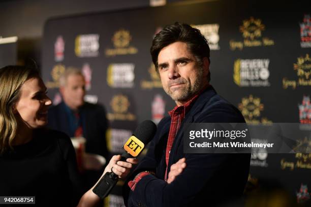 John Stamos attends the 18th Annual International Beverly Hills Film Festival Opening Night Gala Premiere of "Benjamin" at TCL Chinese 6 Theatres on...