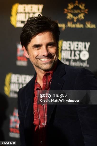 John Stamos attends the 18th Annual International Beverly Hills Film Festival Opening Night Gala Premiere of "Benjamin" at TCL Chinese 6 Theatres on...