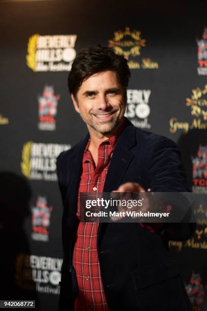 John Stamos attends the 18th Annual International Beverly Hills Film Festival Opening Night Gala Premiere of "Benjamin" at TCL Chinese 6 Theatres on...