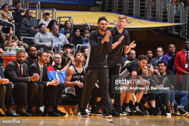 Derrick White and Davis Bertans of the San Antonio Spurs react to a play against the Los Angeles Lakers on April 4, 2018 at STAPLES Center in Los...