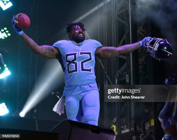 Tennessee Titan, Delanie Walker, shows off new uniform during The NFL's Tennessee Titans team up for the "Tradition Evolved" concert event in...