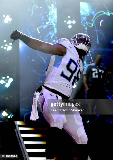 Tennessee Titan, Brian Orakpo, shows off new uniform during The NFL's Tennessee Titans team up for the "Tradition Evolved" concert event in downtown...