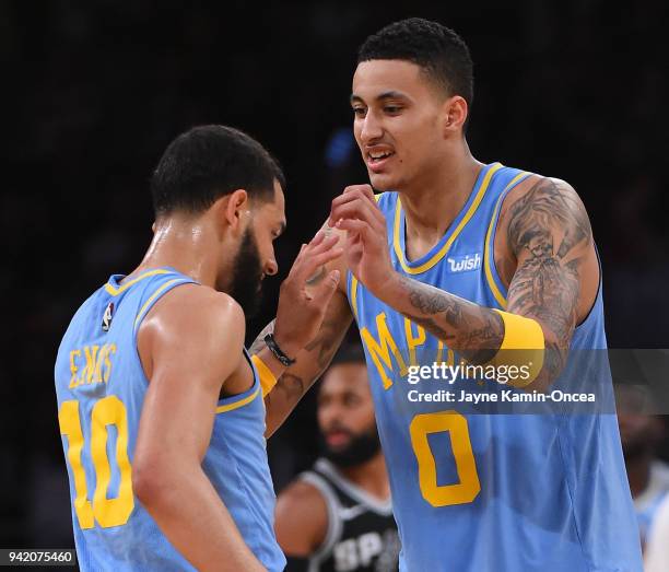 Tyler Ennis gets a high five from Kyle Kuzma of the Los Angeles Lakers after a 3 point basket in the second half of the game against the San Antonio...