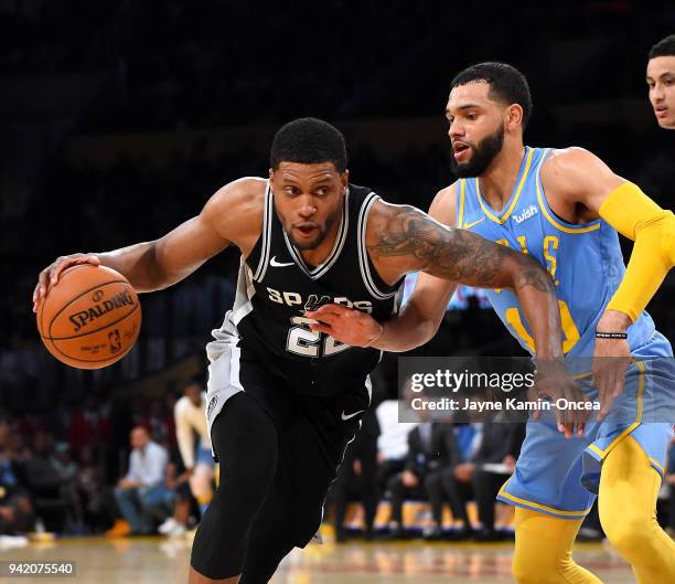 Tyler Ennis of the Los Angeles Lakers defends Rudy Gay of the San Antonio Spurs as he drives to the basket in the second half of the game at Staples...