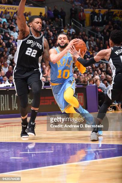 Tyler Ennis of the Los Angeles Lakers handles the ball against Rudy Gay of the San Antonio Spurs on April 4, 2018 at STAPLES Center in Los Angeles,...