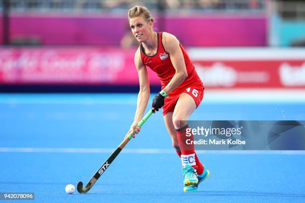 Alexandra Danson of England runs the ball forward during the Pool A Hockey match between South Africa and England on day one of the Gold Coast 2018...