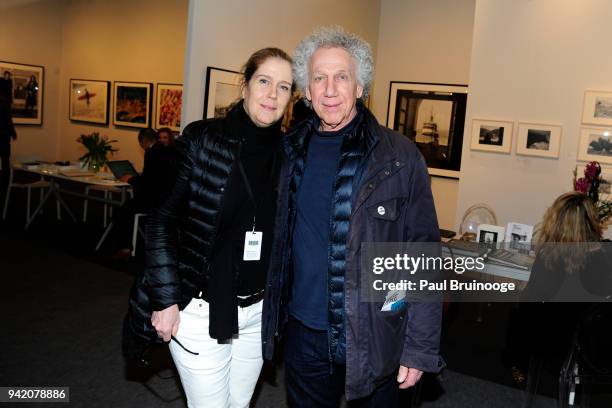 April 4: Elizabeth Gregory-Gruen and Bob Gruen attend The Photography Show presented by AIPAD - Vernissage at Pier 94 in New York, New York, United...