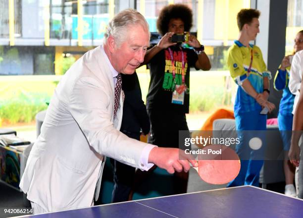 Prince Charles, Prince of Wales plays table tennis during a visit to Athlete's Village on April 5, 2018 in Gold Coast, Australia. The Prince of Wales...