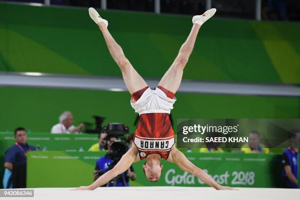 Canada's Jackson Payne competes on the floor exercise during the men's team final and individual qualification in the artistic gymnastics event...