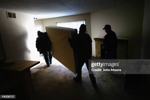 An eviction team removes furniture from an apartment on December 9, 2009 in Colorado Springs, Colorado. The tenant, an unemployed school teacher, had...