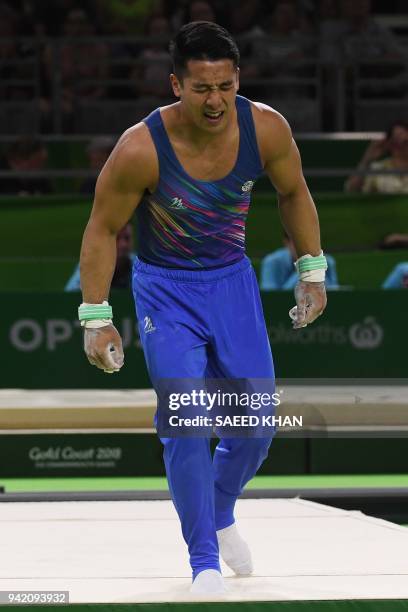 Scotland's Kelvin Cham reacts after his fall in the men's team rings finals during the 2018 Gold Coast Commonwealth Games at the Coomera Indoor...