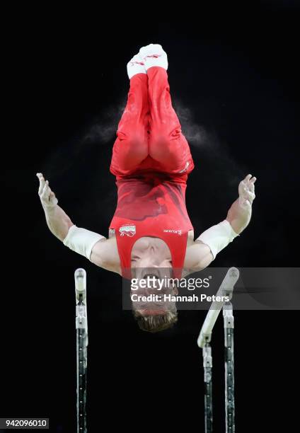 Nile Wilson of England competes on the parallel bars in the Men's Team Final and Individual Qualification during the Artistic Gymnastics on day one...