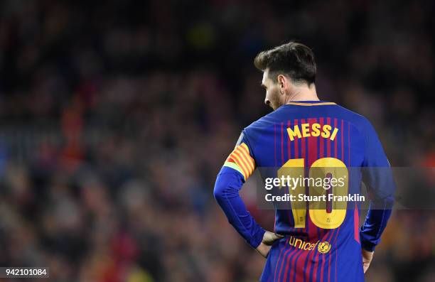 Lionel Messi of Barcelona looks on during the quarter final first leg UEFA Champions League match between FC Barcelona and AS Roma at Camp Nou on...