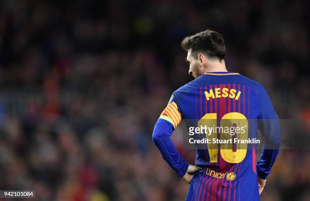 Lionel Messi of Barcelona looks on during the quarter final first leg UEFA Champions League match between FC Barcelona and AS Roma at Camp Nou on...