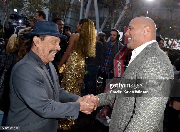 Actors Danny Trajo and Dwayne Johnson arrive at the premiere of Warner Bros. Pictures' "Rampage" at the Microsoft Theatre on April 4, 2018 in Los...