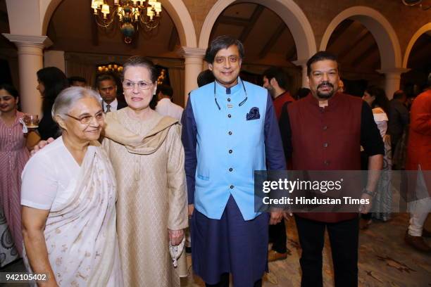 Former Delhi Chief Minister Sheila Dixit, UPA chairperson Sonia Gandhi, and Congress leader Shashi Tharoor with journalist Vir Sanghvi during the...