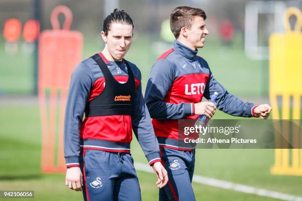 Aaron Lewis and Tom Carroll in action during the Swansea City Training at The Fairwood Training Ground on April 4, 2018 in Swansea, Wales.