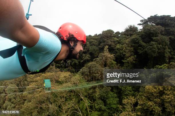 selfie of man practicing canopy in costa rica - costa rica zipline stock pictures, royalty-free photos & images