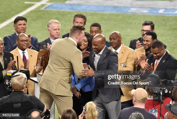 Watt with the Walter Payton Man of the Year Award on the field prior to the start of Super Bowl LII between the Philadelphia Eagles and New England...