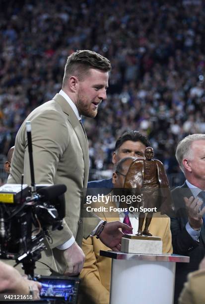 Watt with the Walter Payton Man of the Year Award on the field prior to the start of Super Bowl LII between the Philadelphia Eagles and New England...