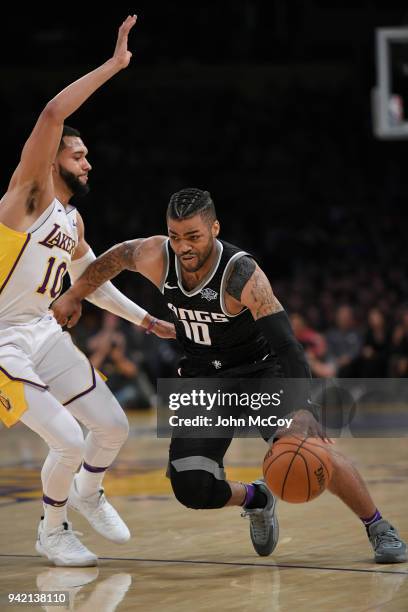 Frank Mason III of the Sacramento Kings drives past Tyler Ennis of the Los Angeles Lakers at Staples Center on April 1, 2018 in Los Angeles,...