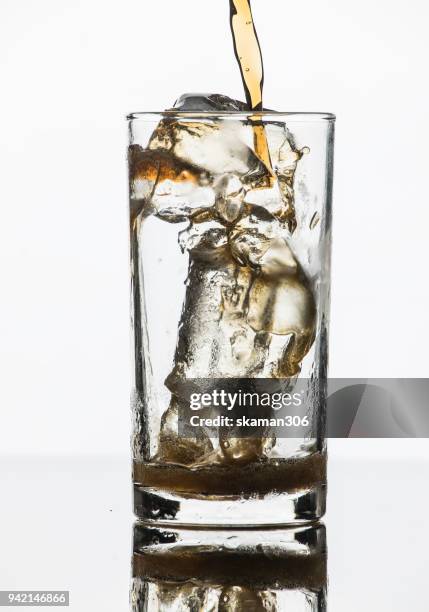 selective focus drink alcohol and water glass with whisky and sparking water and ice cube - whiskey tasting stock pictures, royalty-free photos & images