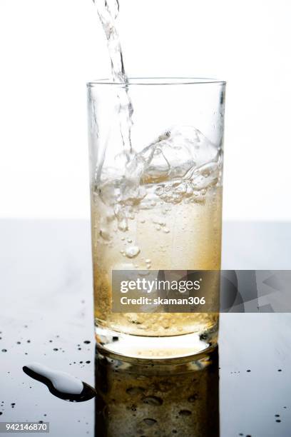 selective focus drink alcohol and water glass with whisky and sparking water and ice cube - whiskey tasting stock pictures, royalty-free photos & images