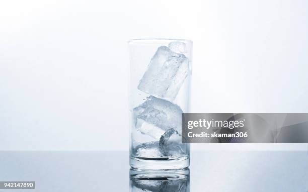 selective focus drink alcohol and water glass with whisky and sparking water and ice cube - whiskey tasting stock pictures, royalty-free photos & images