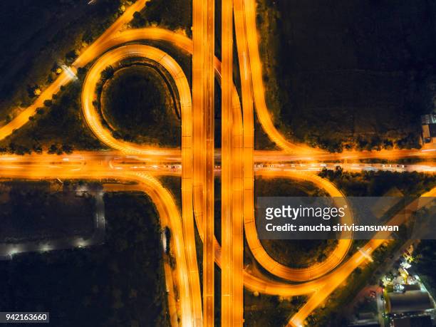 aerial top view, expressway road shape infinity car light at night, bangkok, thailand. - car aerial view stock pictures, royalty-free photos & images