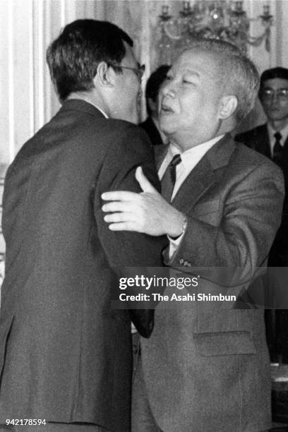 Prince Norodom Sihanouk of Cambodia and Prime Minister Hun Sen hug prior to the Tokyo Meeting on Cambodia at the Akasaka State Guesthouse on June 4,...