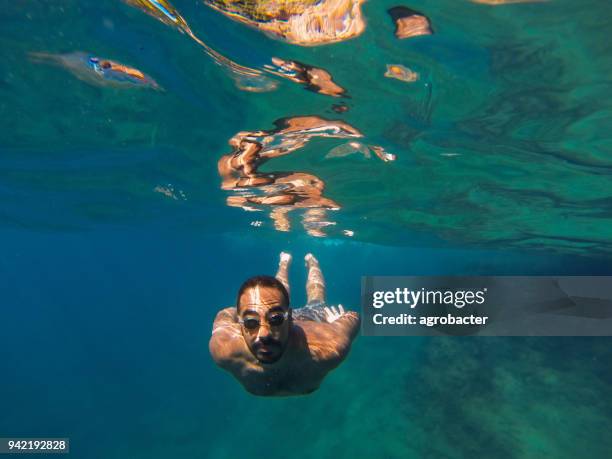 exploring under the water - one man only stock pictures, royalty-free photos & images