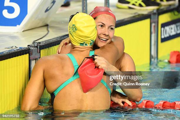 Aimee Willmott of England embraces Blair Evans of Australia following the Women's 400m Individual Medley Final on day one of the Gold Coast 2018...