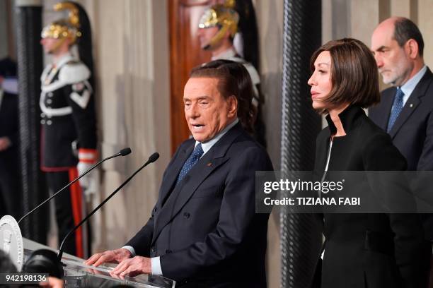 Silvio Berlusconi , leader of the right-wing party "Forza Italia" speaks to the press flanked by Anna Maria Bernini after a meeting with Italian...