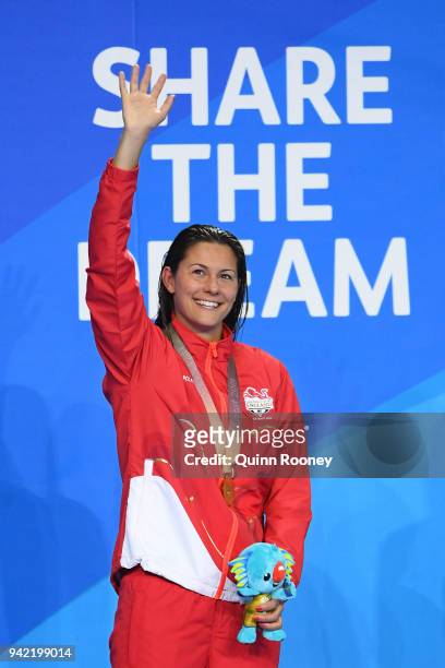 Gold medalist Aimee Willmott of England poses during the medal ceremony for the Women's 400m Individual Medley Final on day one of the Gold Coast...