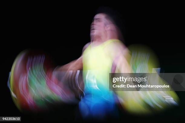 Vannara Be of Australia competes during the Weightlifting Men's 62kg Final on day one of the Gold Coast 2018 Commonwealth Games at Carrara Sports and...