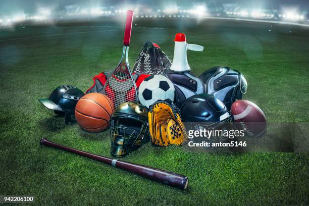 sports balls on the field with yard line. soccer ball, american football and baseball in yellow glove on green grass. outdoors - sports equipment stock pictures, royalty-free photos & images